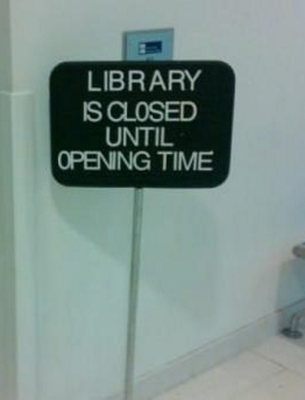 sign - Library Is Closed Until Opening Time