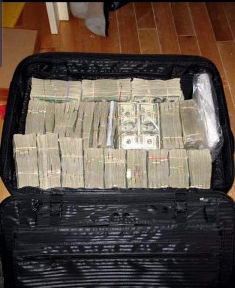 dollar in suitcase