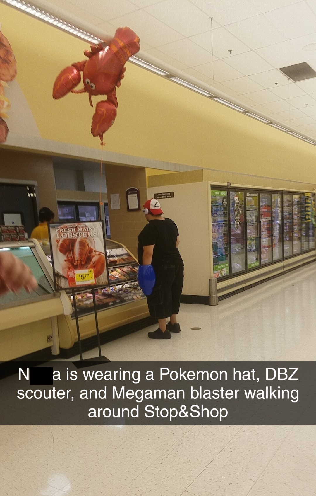 supermarket - N a is wearing a Pokemon hat, Dbz scouter, and Megaman blaster walking around Stop&Shop