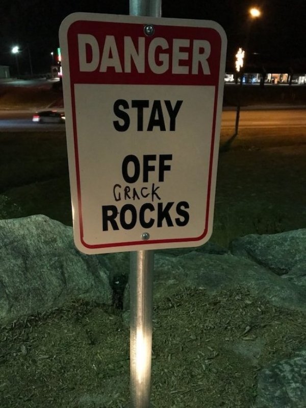 street sign - Danger Stay Off Grack Rocks