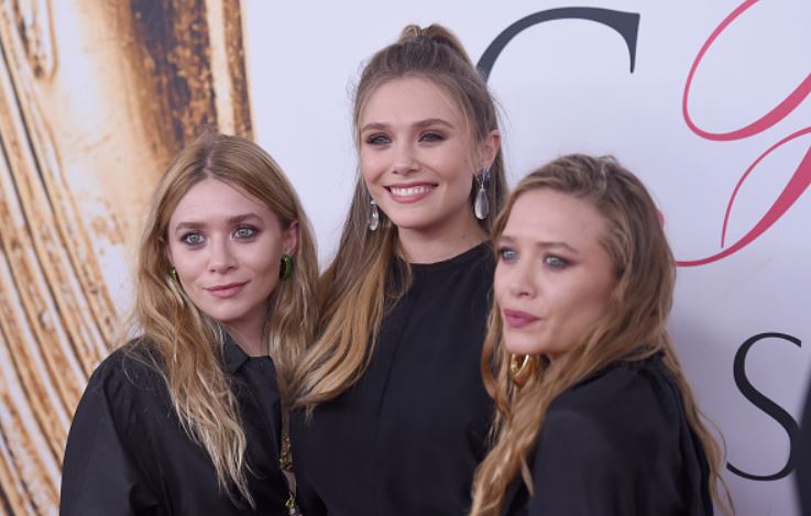 Mary-Kate, Ashley Olsen, and their third sister Elizabeth