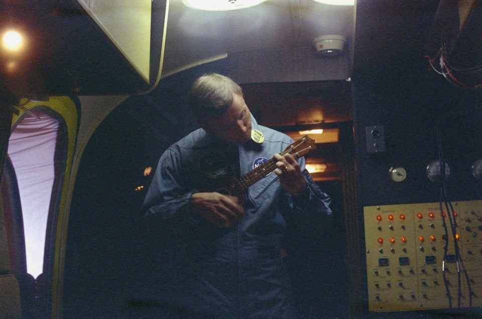 Neil Armstrong, in quarantine post-Apollo 11, playing his ukelele - 1969