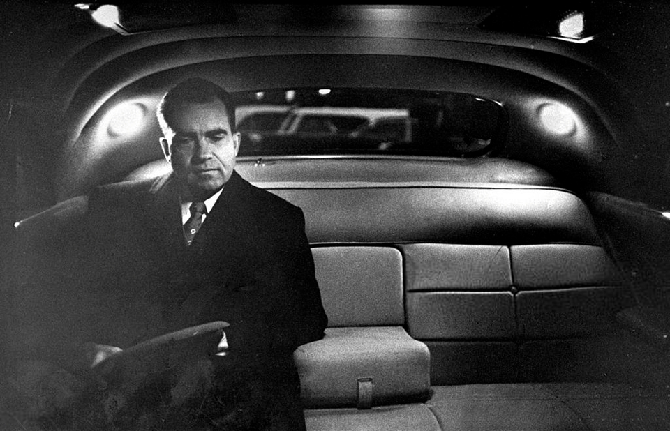 Vice President Richard Nixon sat in the back of a limousine after finishing his day at the White House. 1957.