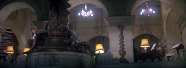 During Superman: The Movie (1978), the statue Eve Teschmacher hides behind before she decides to betray Lex Luthor and help Superman is inscribed “Progress.”