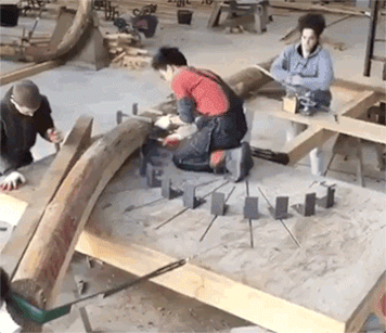 Bending a wooden log