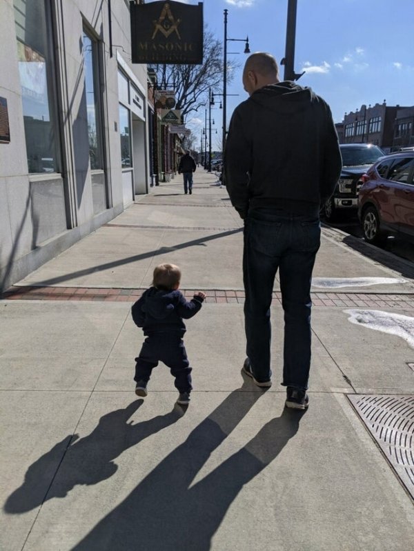 Me and my 11 month walking down the sidewalk.