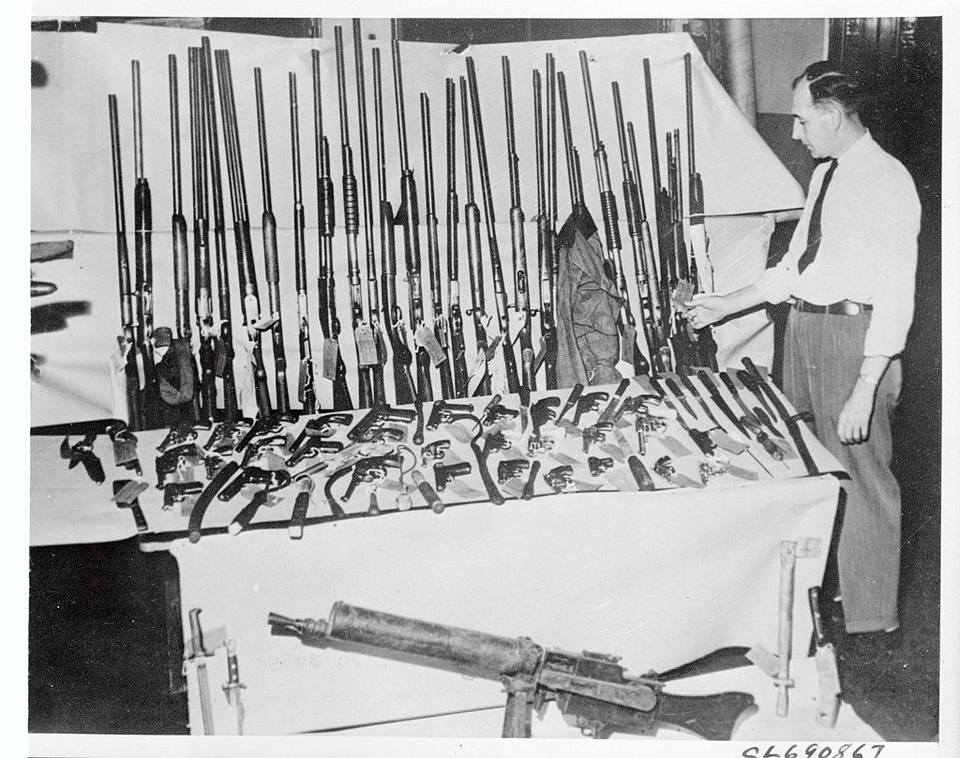 Weapons from rioters during the 1943 Detroit race riot are taken by police and stored here at police headquarters in Detroit, Michigan (June 1943)