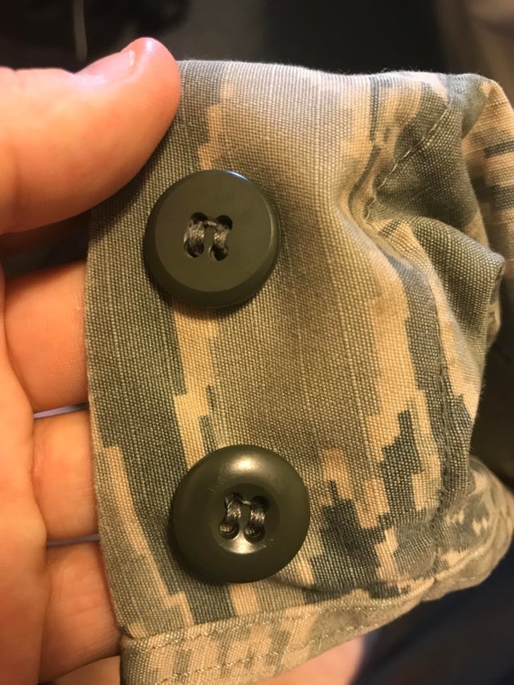 “The button on the right sleeve of my uniform has been worn down due to years of it being dragged on a desk while I was using a mouse.”
