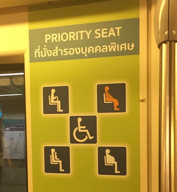 “Monks are included on priority seating signs in Thailand.”
