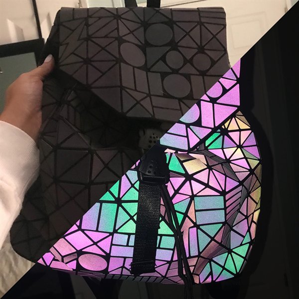 “This book bag I bought at Comic Con today glows with flash photography.”