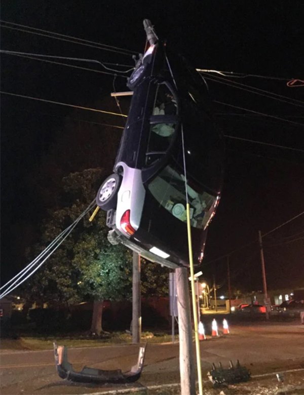 They drove their car up a pole