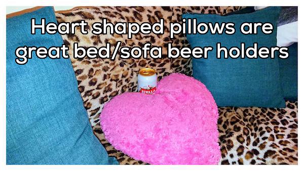 photo caption - Heart shaped pillows are great bedsofa beer holders