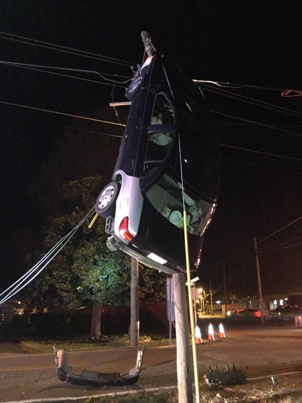 car hanging from power lines