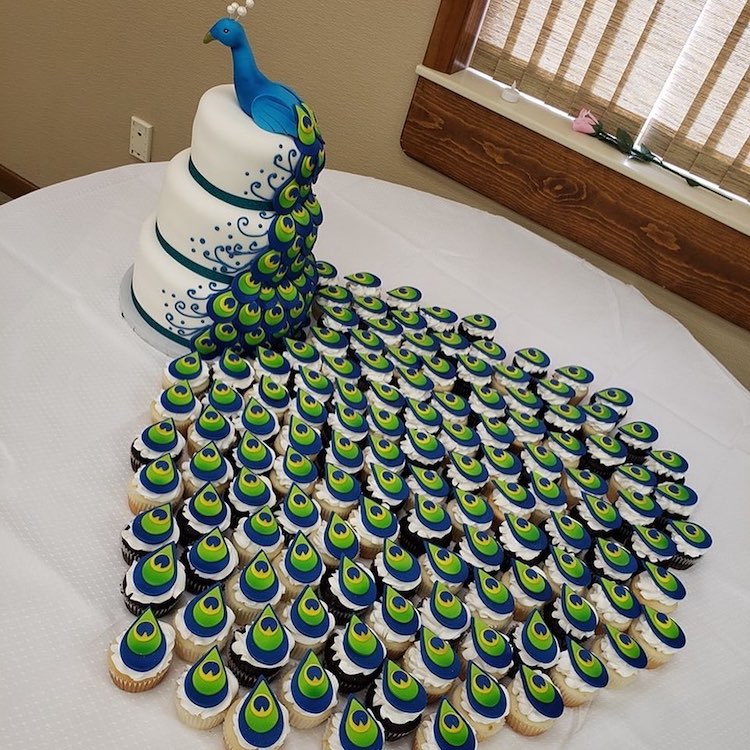 peacock cake and cupcakes