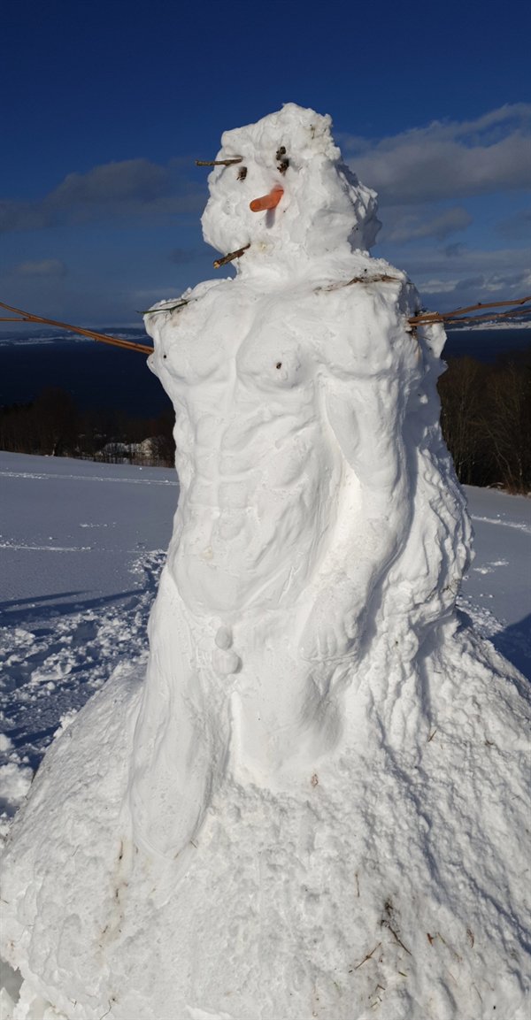 snowman with chiseled torso and muscles to look like David sculpture by Michaelangelo