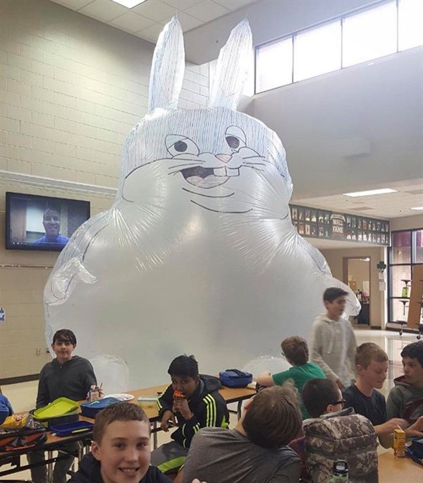 big chungus inflatable balloon bunny rabbit character in lunchroom with students