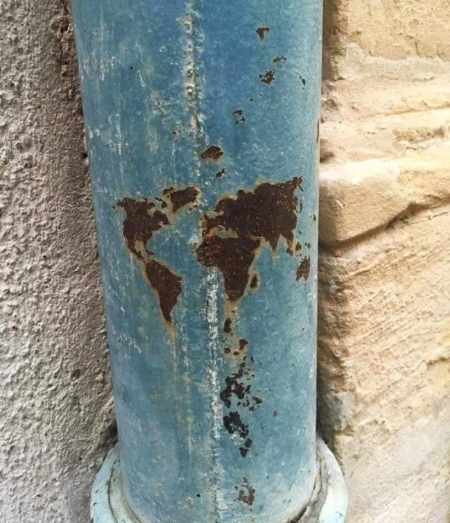 This world map on the downspout