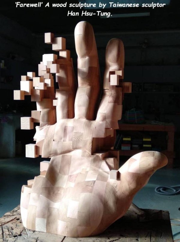 'Farewell' A wood sculpture by Taiwanese sculptor Han HsuTung.