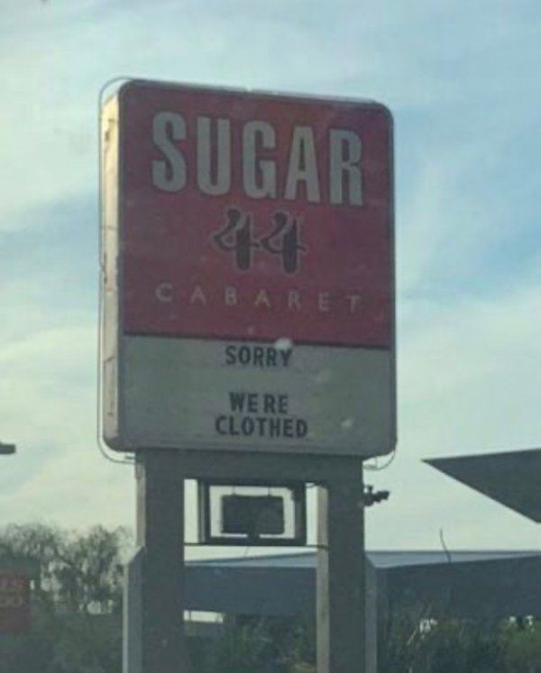 street sign - Sugar Cabaret Sorry Were Clothed