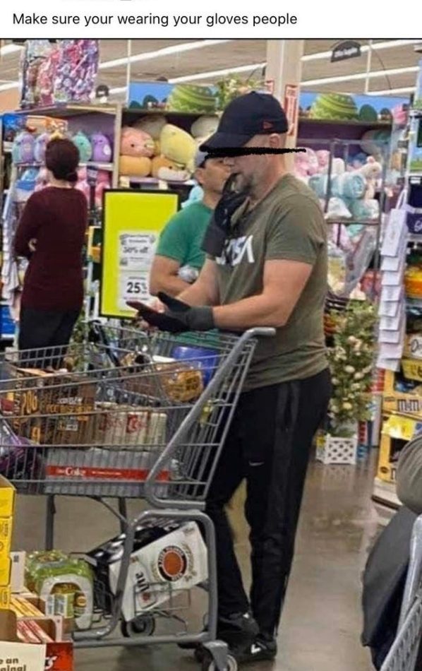 man in supermarket  chewing on his glove - Make sure you're wearing your gloves people