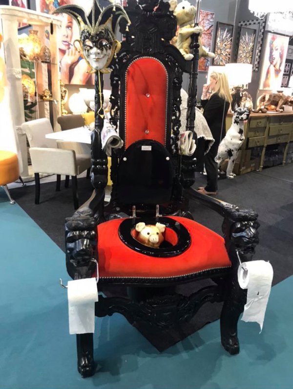 throne with toilet paper rolls on it