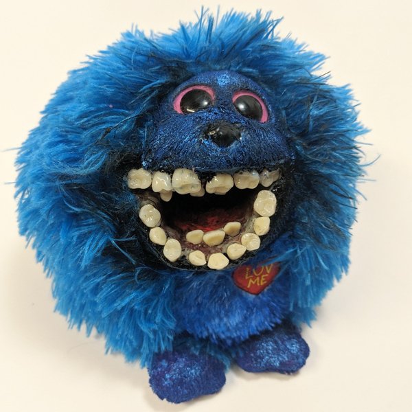 stuffed toy with human teeth