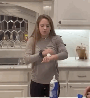 perfectly timed photos - girl failing to eat whipped cream