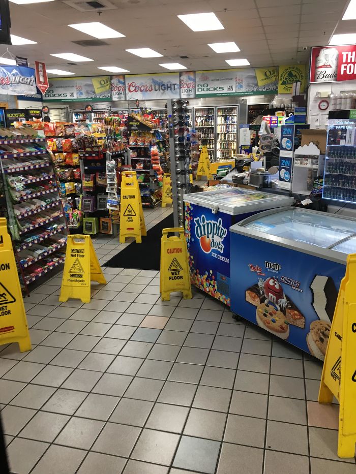 gas station store filled with wet floor signs