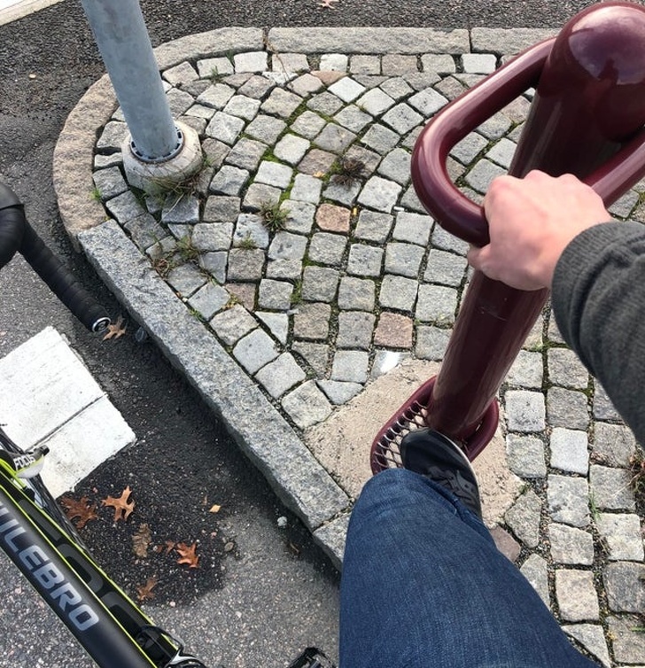 A stand for bikers to hold on to while waiting for traffic lights in Sweden