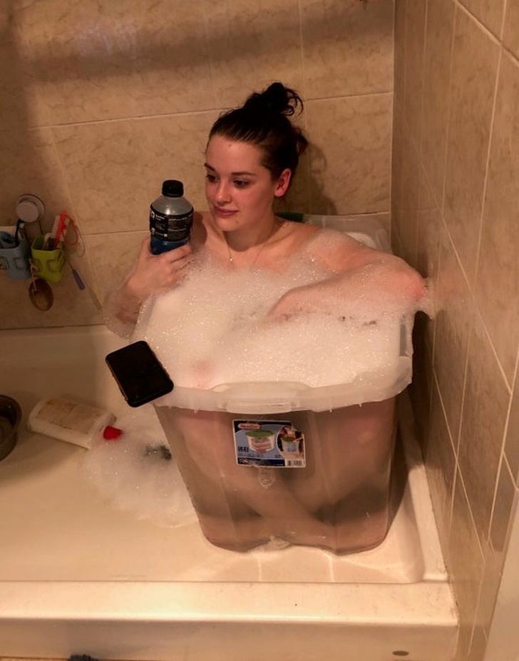 genius problem solvers - girl taking bubble bath in large plastic tupperware container