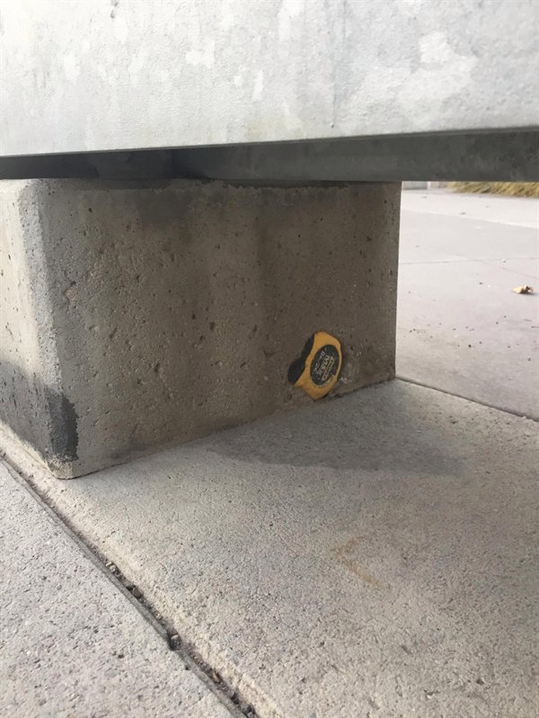 measuring tape accidentally hardened into the cement at a construction site