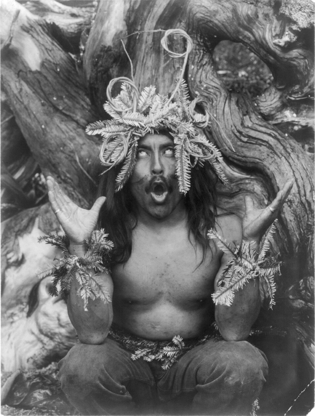 Hamatsa shaman of the Koskimo (People of Guseʼ) tribe possessed by supernatural power after having spent several days in the woods as part of an initiation ritual. Western Canada. 1914.