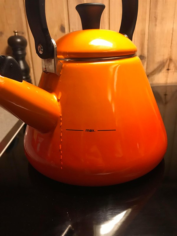 orange water kettle with really low max fill line
