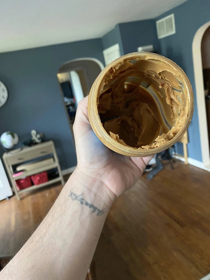 “My wife putting this peanut butter in the trash because it’s empty...”