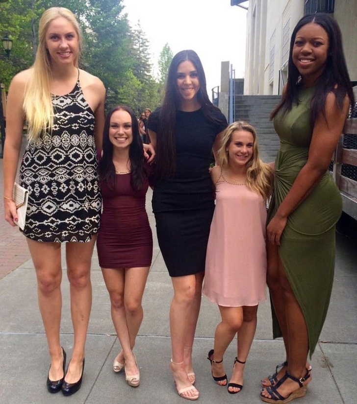 female basketball players next to cheerleaders -