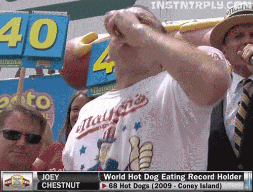 champion guy eating nathan's hot dog contest winner