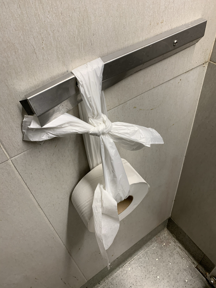 toilet paper roll held up by toilet paper