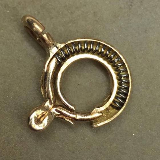 brass jewelry clasp ring cut in half