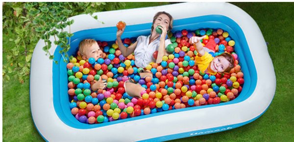 poorly photoshopped woman playing in ball pit with kids