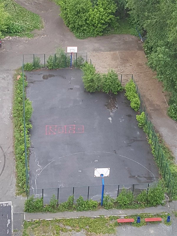 Basketball court with chunk taken out of it poorly planned