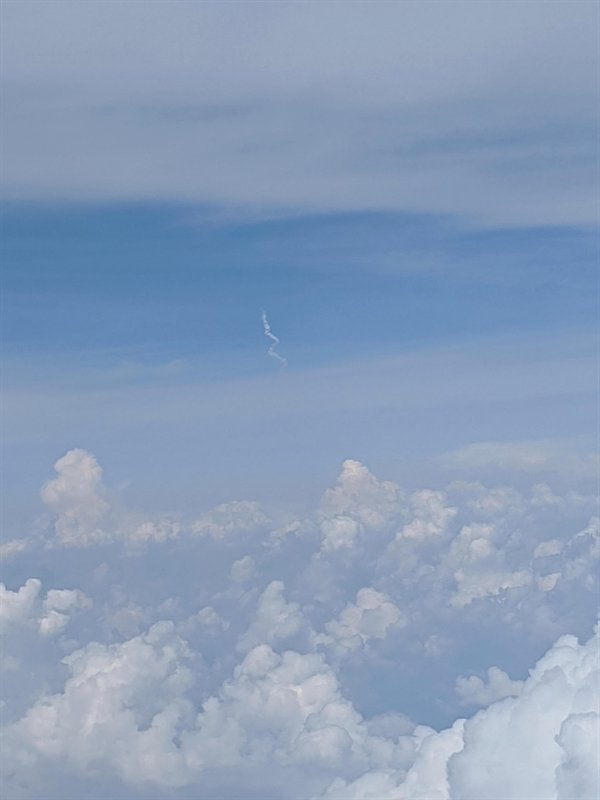 spacex launch as seen from an airplane