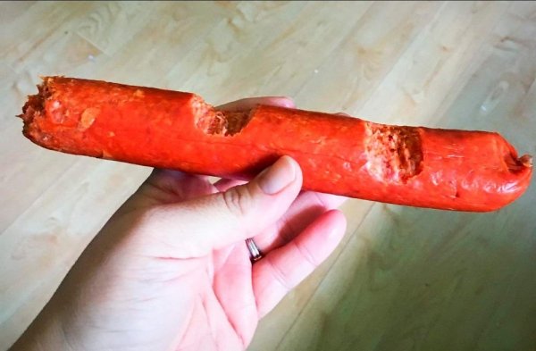 hotdog sausage with weird bites taken out of it