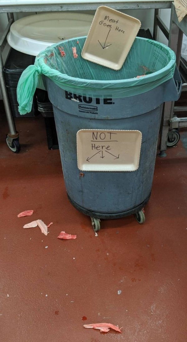 Meat Goes Here Not Here - trashcan with food on the floor around it