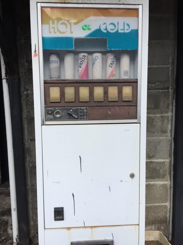 old abandoned soda vending machine