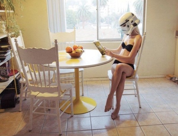 girl wearing storm trooper helmet - Com
