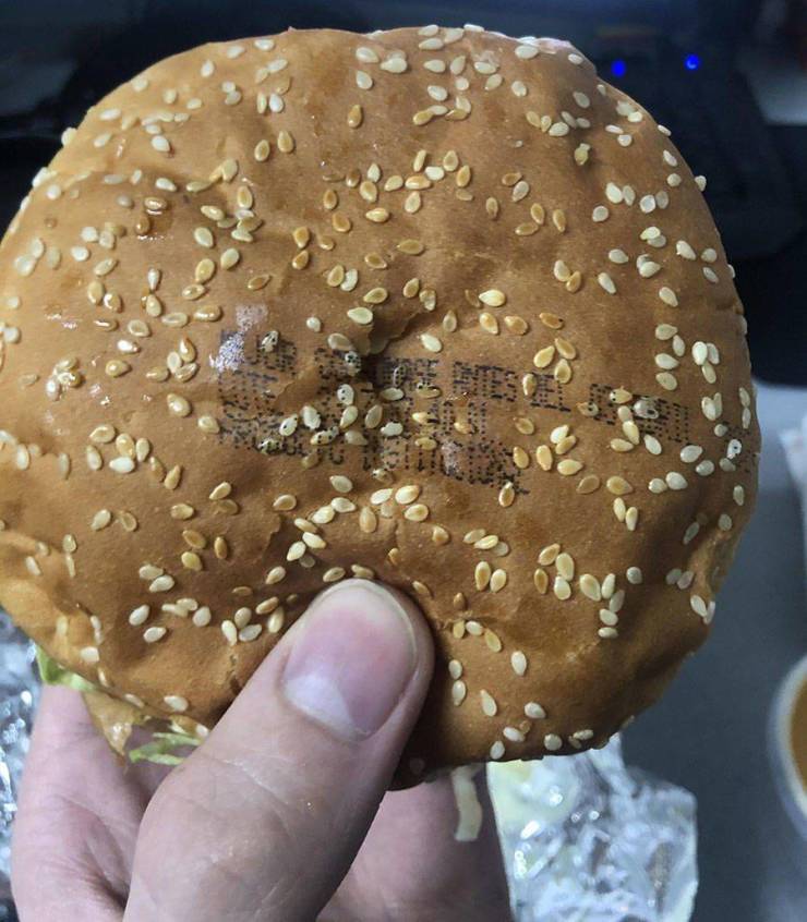 burger bun with words printed on it in ink