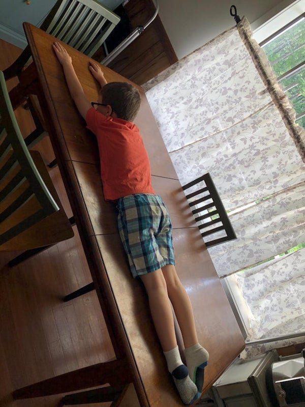 husband sent wife photo of son lying across kitchen table to measure it