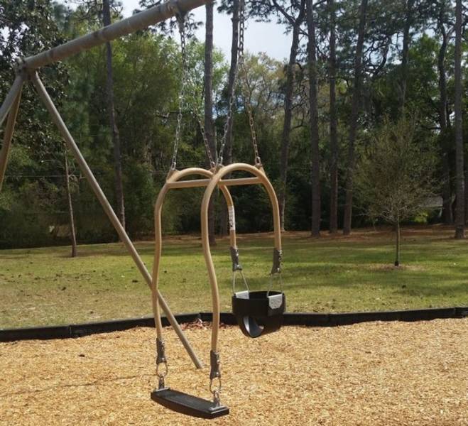 Parents can swing together with a toddler.