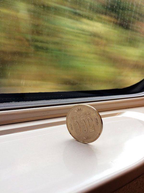 coin on japan train not falling over