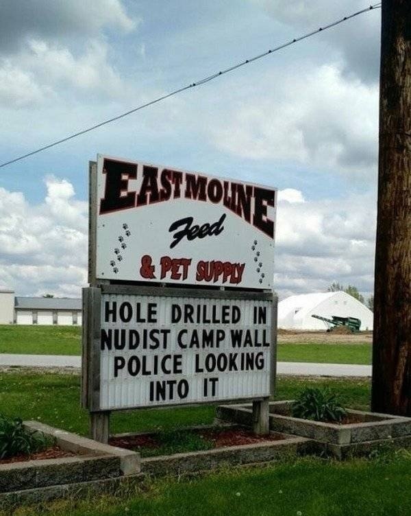 sign - E Astmoine Feed & Pet Suppy Hole Drilled In Nudist Camp Wall Police Looking Into It